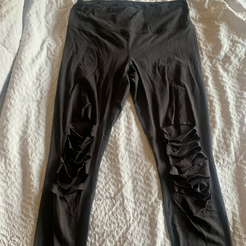 Very soft black leggings with machine made rips in knees
